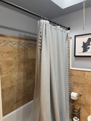 Shower, hair dryer, towels, toilet paper