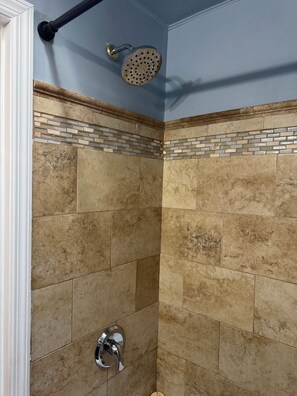 Shower, hair dryer, towels, toilet paper