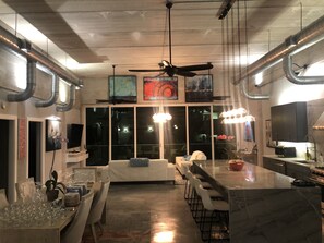 Enjoy cooking and dining in this well-equipped kitchen with a central island, sink, and ample seating.