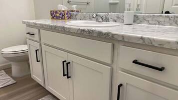 Bathtub, hair dryer, towels
