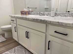 Bathtub, hair dryer, towels