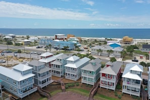 Enjoy expansive ocean and beach views from the property's multi-story buildings with prominent balconies.