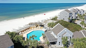 A beachfront hotel with a swimming pool, beach access, and multiple guest rooms. - Barrier Dunes 164 - 144 Bay Breeze (Port St. Joe)