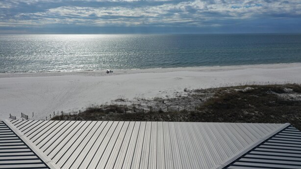 A beach view from a wooden deck with a clear sky. - Surfside 15 - Beachtime (Port St. Joe)