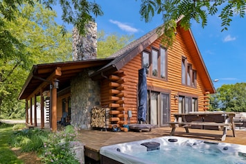 Relax on Scout’s Haven’s outside deck, complete with an in-ground hot tub.