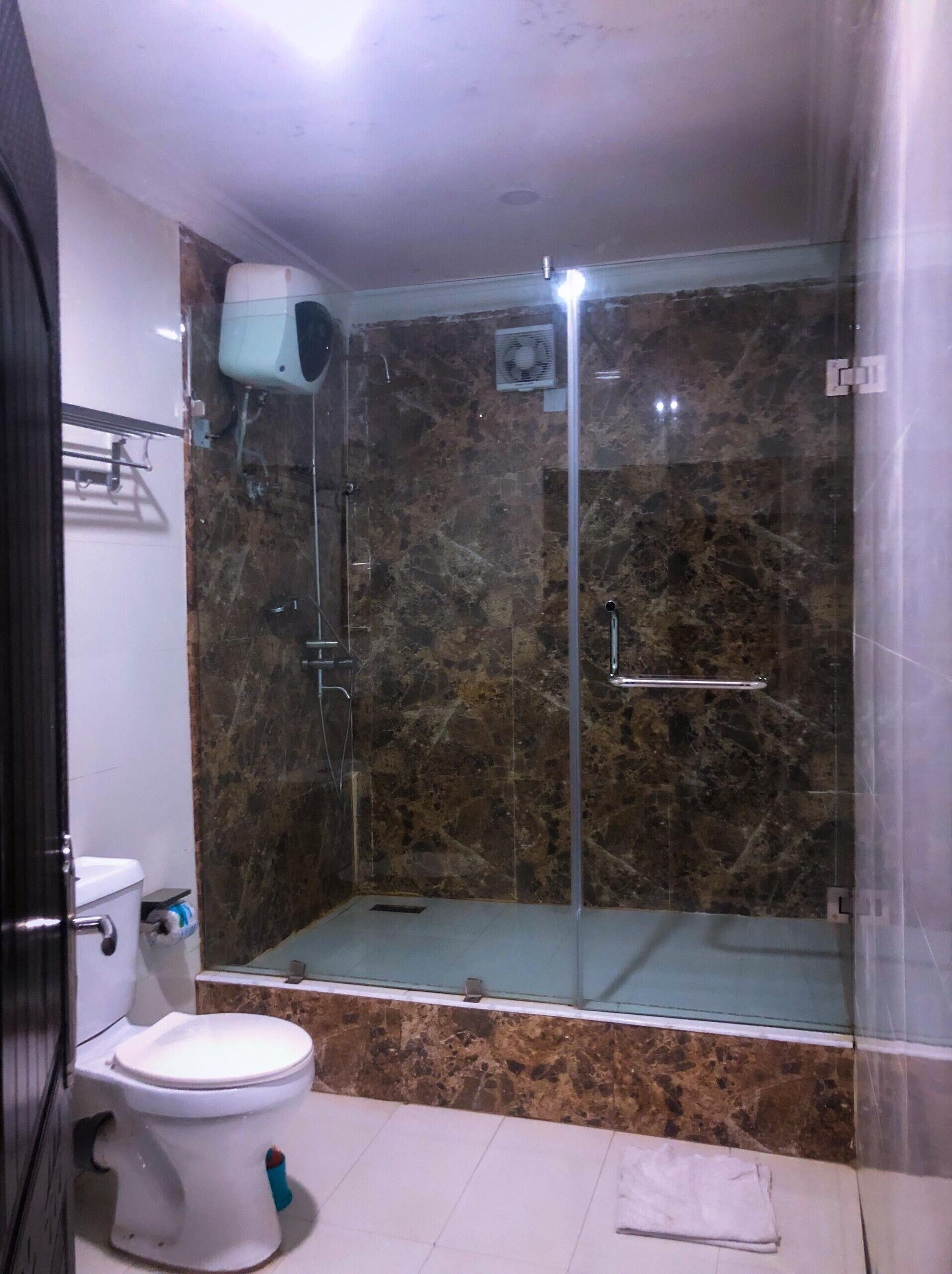Shower, rainfall showerhead, hair dryer, towels