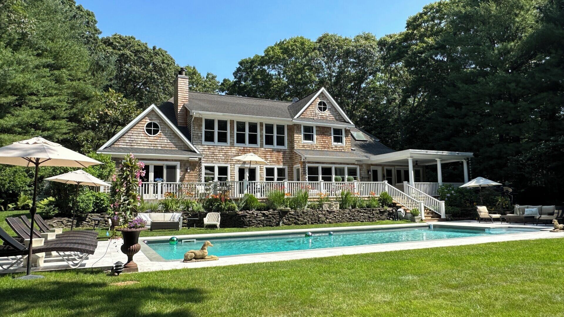 Remarkable Hamptons estate, resort-style amenities, large pool, multiple...