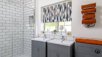 Shower, hair dryer, towels, soap