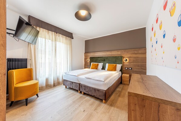 Premium bedding, down comforters, pillowtop beds, in-room safe