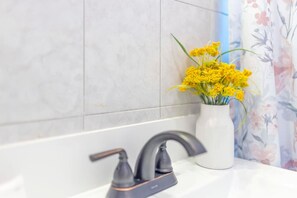 Bathtub, hair dryer, towels, soap