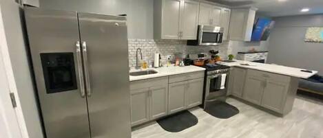 Fridge, microwave, stovetop, coffee/tea maker