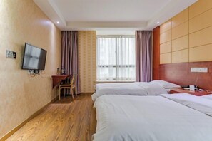 A hotel room with two beds, a desk with a chair, a television, and a window with curtains. - Dijing Express Hotel (Qingyang)