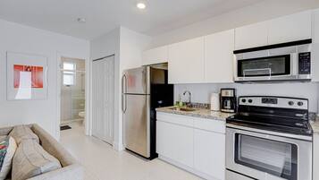 Apartment | Private kitchen | Full-size fridge, microwave, oven, stovetop