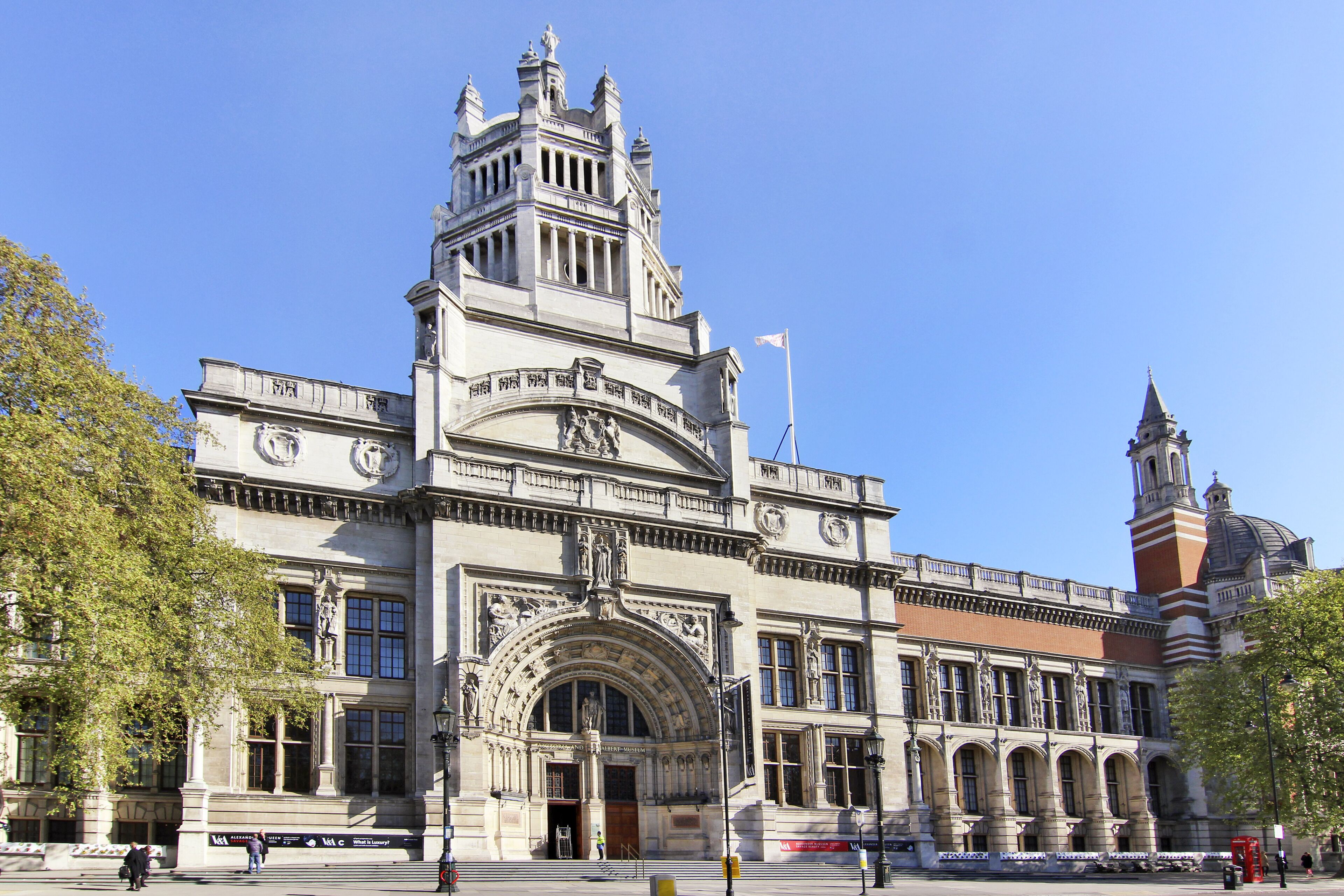 A historic building with a prominent clock tower and arched entrance.