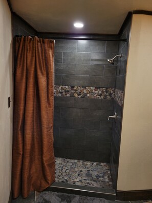 Shower, hair dryer, towels, toilet paper
