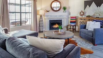 Smart TV, fireplace, books, video library