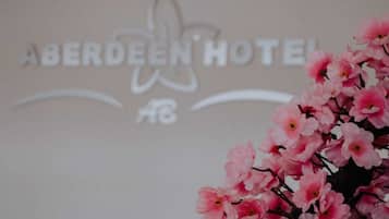 The sign of the Aberdeen Hotel with a floral design.