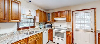 Comfortable home near beach with enclosed porch, washer/dryer, & central AC