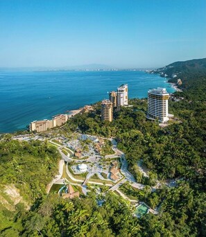 Enjoy breathtaking ocean views from this hillside resort, surrounded by lush greenery and multiple pools.