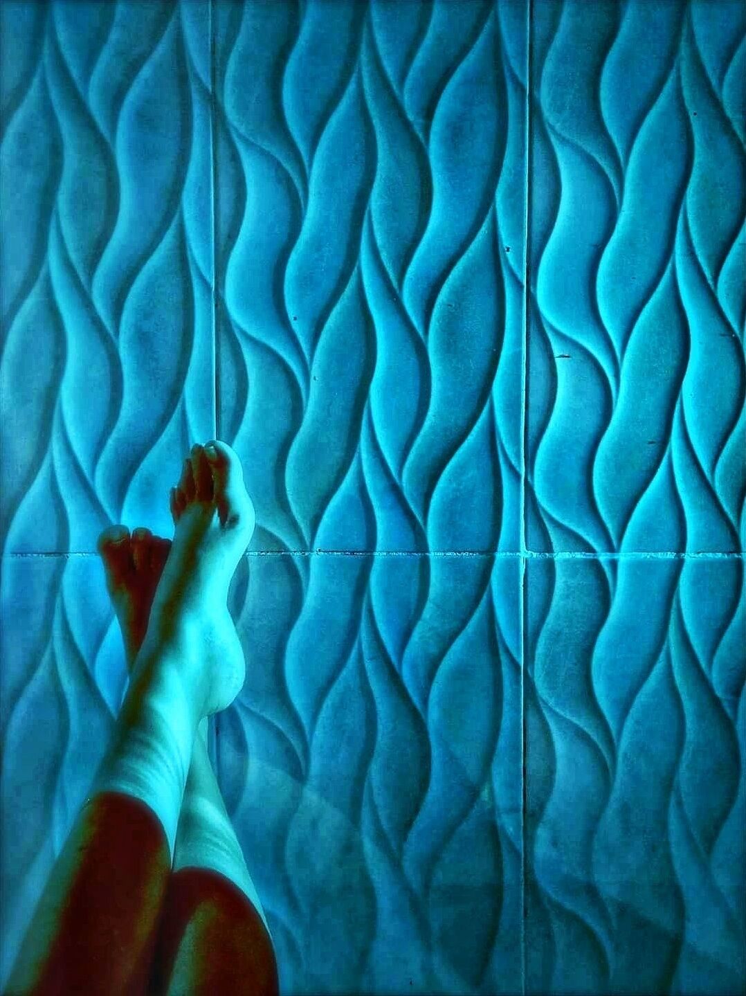 A tiled floor with a wavy pattern.