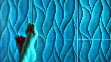A tiled floor with a wavy pattern.