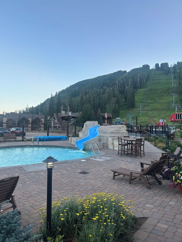 Outdoor pool, a heated pool - Charming condo surrounded by the San Juan Mountains at Purgatory resort. (Durango)