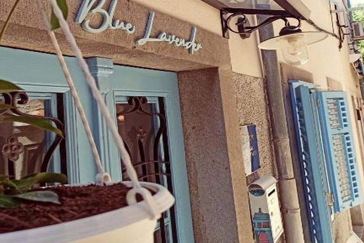 A building facade with a sign reading "Blue Lavender."