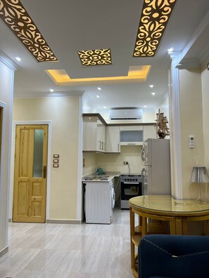 Apartment | Private kitchen | Fridge, microwave, oven, stovetop - Captivating 1-bed Apartment in Egypt (Shurtah al-Dakhlah)