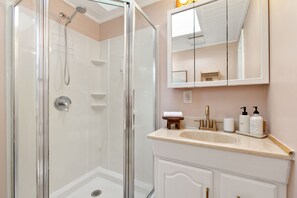 Shower, hair dryer, towels, soap
