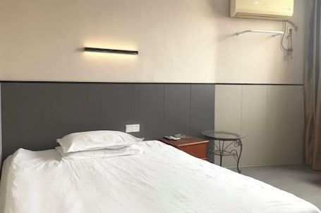 Room. Jixi Motel Business Hotel