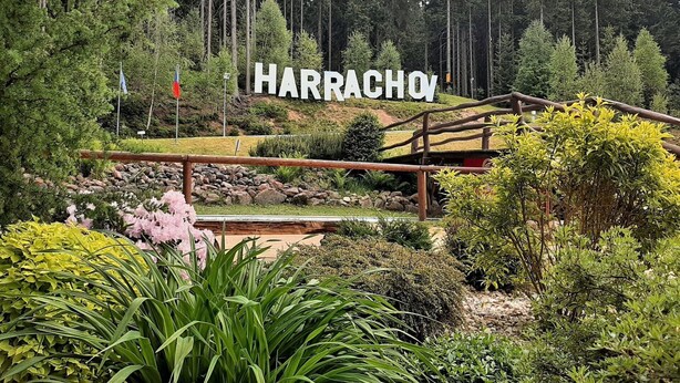 A sign reading "HARRACHOV" in a forested area with a wooden bridge and various plants. - Lovely apartment for 6 guests with WIFI, TV and balcony (Jilemnice)