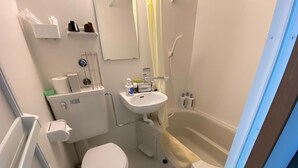 A compact bathroom with a toilet, sink, and bathtub. - Shinosaka 1 min  (Osaka)