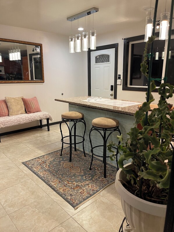 Door in the back leads to the front deck and patio