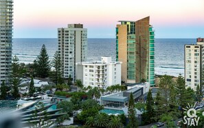 Experience the Carlton's unique blend of glass and brick architecture, set amidst lush greenery and offering scenic views of the ocean.