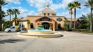 A building with a sign for 'Regal Palms Bar, Restaurant, Spa'. - Oasis at Regal Palms - Near Disney  (Davenport)