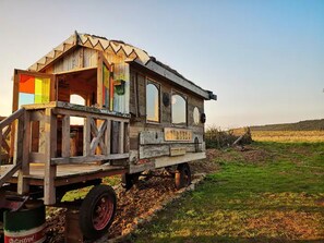 A wooden structure with a sign reading "Circus" on a trailer. - 2 x Double Bed, Glamping Wagon in Dalby Forest (Scarborough)