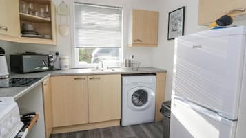 Fridge, electric kettle, toaster, cookware/dishes/utensils