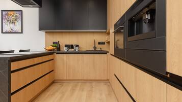 Dishwasher, coffee/tea maker, cookware/dishes/utensils