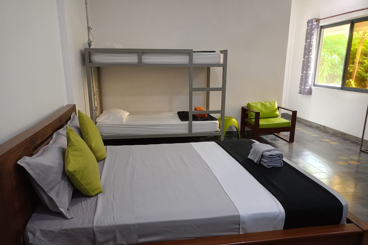 Family Room | Premium bedding, desk, laptop workspace, blackout curtains
