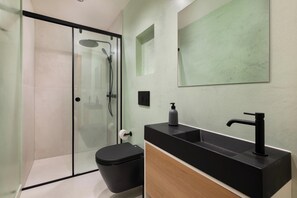 Shower, hair dryer, towels, toilet paper