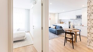A modern apartment with a living area, a dining space, and a kitchen. - Rua do Paraíso (Porto)
