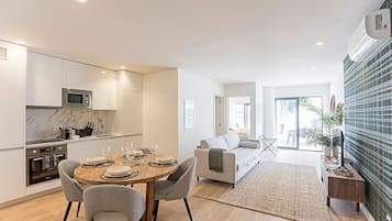 City Apartment | Living area | Flat-screen TV