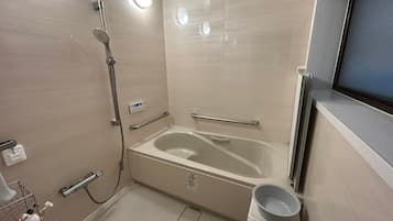 Combined shower/tub, free toiletries, hair dryer, slippers