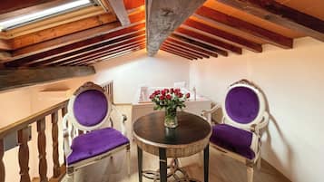 Premium Studio Suite | Living area | 32-inch flat-screen TV with satellite channels, TV