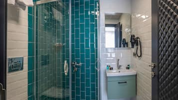 Shower, hair dryer, slippers, towels