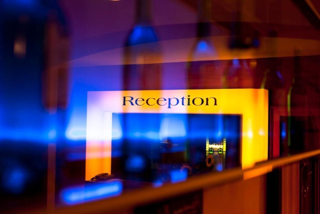 A reception area with a sign that reads "Reception" in a yellow box.