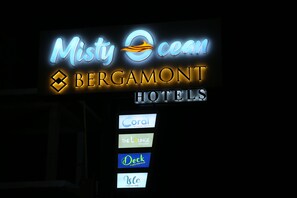 A hotel sign with the name "Misty Ocean Bergamot Hotels" and logos for "Coral," "The Lounge," "Deck," and "Vibe." - Misty Ocean-A Bergamont Group of Hotels (Vanur)