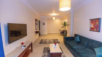Junior Suite, Non Smoking, Pool View | Living area | 32-inch LCD TV with satellite channels, TV, fireplace