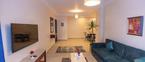 Junior Suite, Non Smoking, Pool View | Living area | 32-inch LCD TV with satellite channels, TV, fireplace