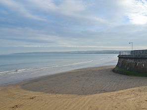 A beach with a concrete sea wall and a lamp post. - Filey Central Two - UK42903 (Filey)